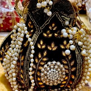 Handcrafted by zardosi work on shiny Raw Silk....